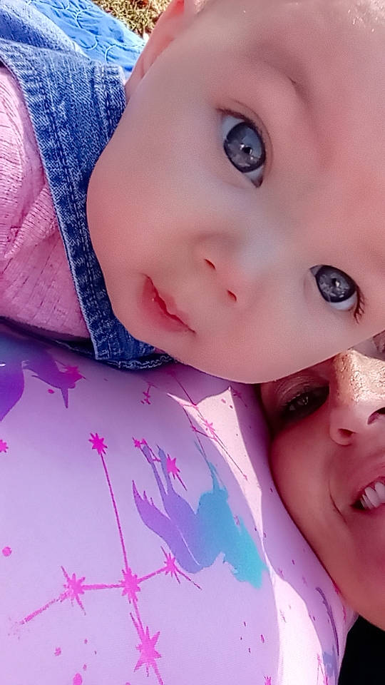 Kiara joined the competition — help win amazing prizes! cheek, ear, eyebrow, eyelash, forehead, gesture, happy, iris, jaw, lip, mouth, neck, nose, person, pink, purple, skin, sleeve, smile, toddler