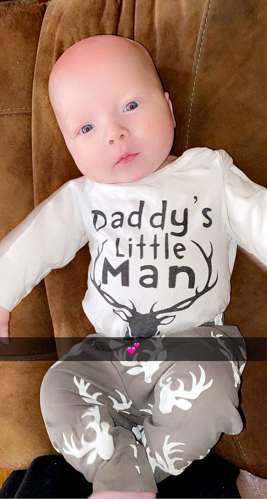 Tanner joined the competition — help win amazing prizes! baby, baby_toddler_clothing, black, cheek, child, face, fashion_accessory, font, gadget, happy, linens, neck, organ, pattern, person, pink, sitting, sleeve, t_shirt, toddler