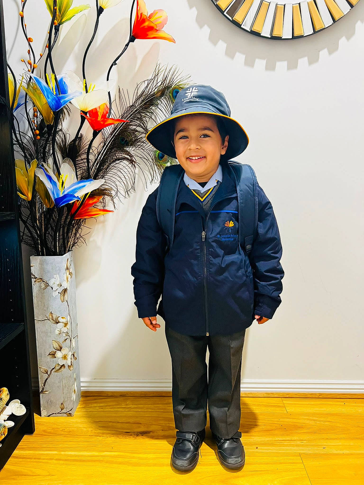 Aveer is registered to the contest to win money with this photo: art, artist, cap, child, costume_hat, electric_blue, event, fashion_accessory, flooring, fun, happy, hat, headgear, headwear, joy, orange, person, smile, standing, sun_hat