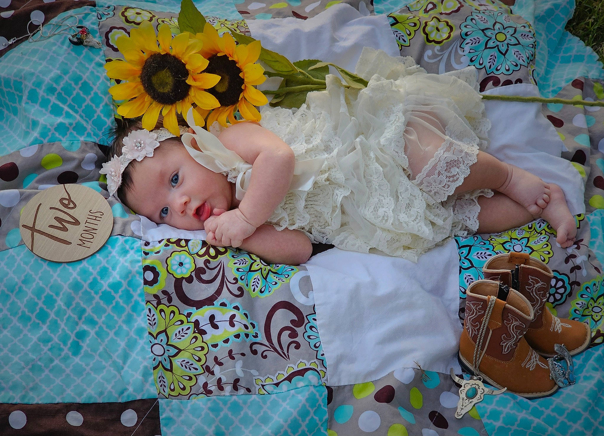 Cheyenne is registered to the contest to win money with this photo: baby, baby_products, baby_sleeping, baby_toddler_clothing, blue, child, cut_flowers, fashion_accessory, flower, green, hair_accessory, happy, headband, headpiece, headwear, linens, pattern, person, petal, room