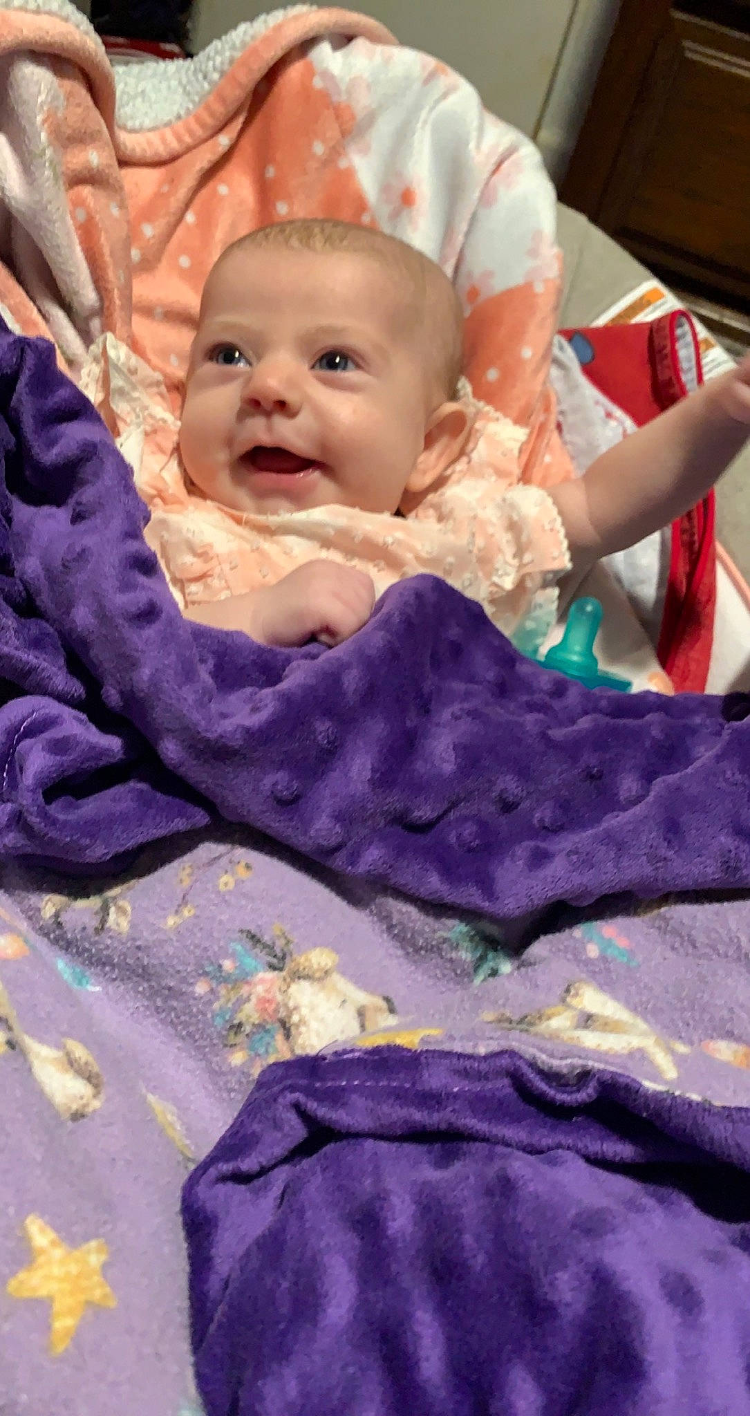 Elaina is registered to the contest to win money with this photo: baby, baby_products, baby_toddler_clothing, cheek, child, comfort, eye, fun, happy, head, iris, linens, magenta, person, pink, purple, skin, smile, textile, toddler