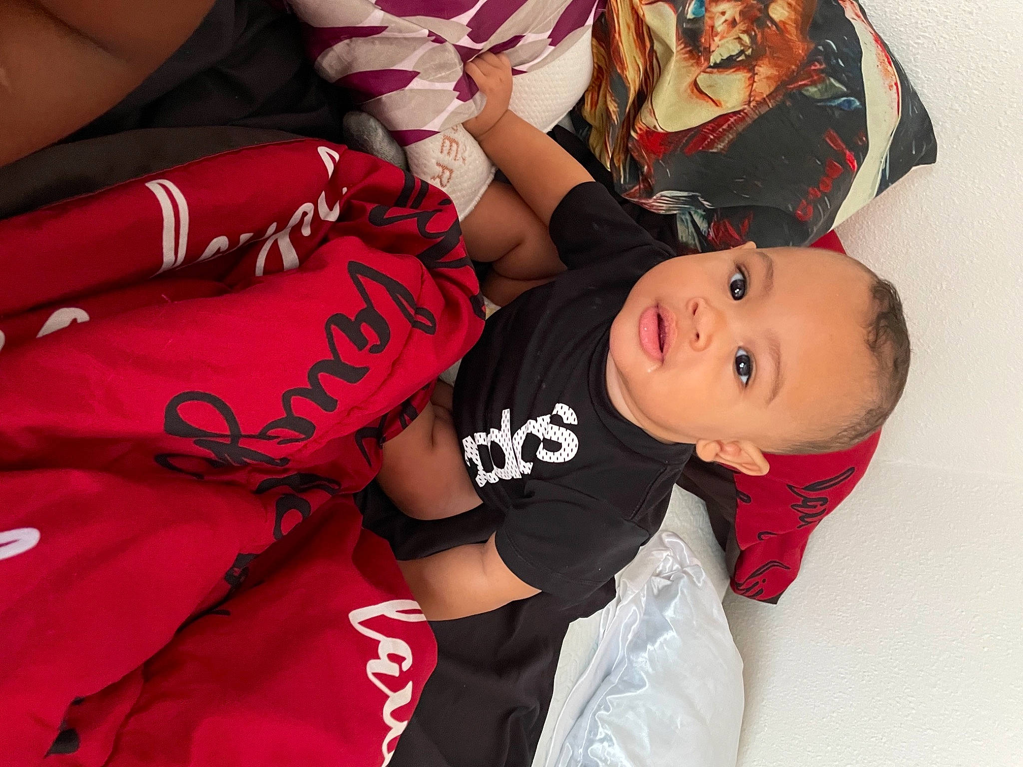 Kian joined the competition — help win amazing prizes! arm, baby, baby_toddler_clothing, comfort, dress, elbow, event, finger, fun, gesture, hand, happy, human_leg, magenta, person, pink, red, sleeve, smile, thigh