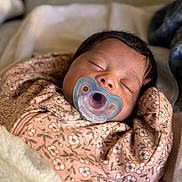 Alani joined the competition — help win amazing prizes! baby, sleeping, pacifier, blanket, floral_pattern, pink_clothing, infant, cute, peaceful, cozy, child, portrait, indoors, soft_texture, newborn, resting, closeup, head, face, hands_up