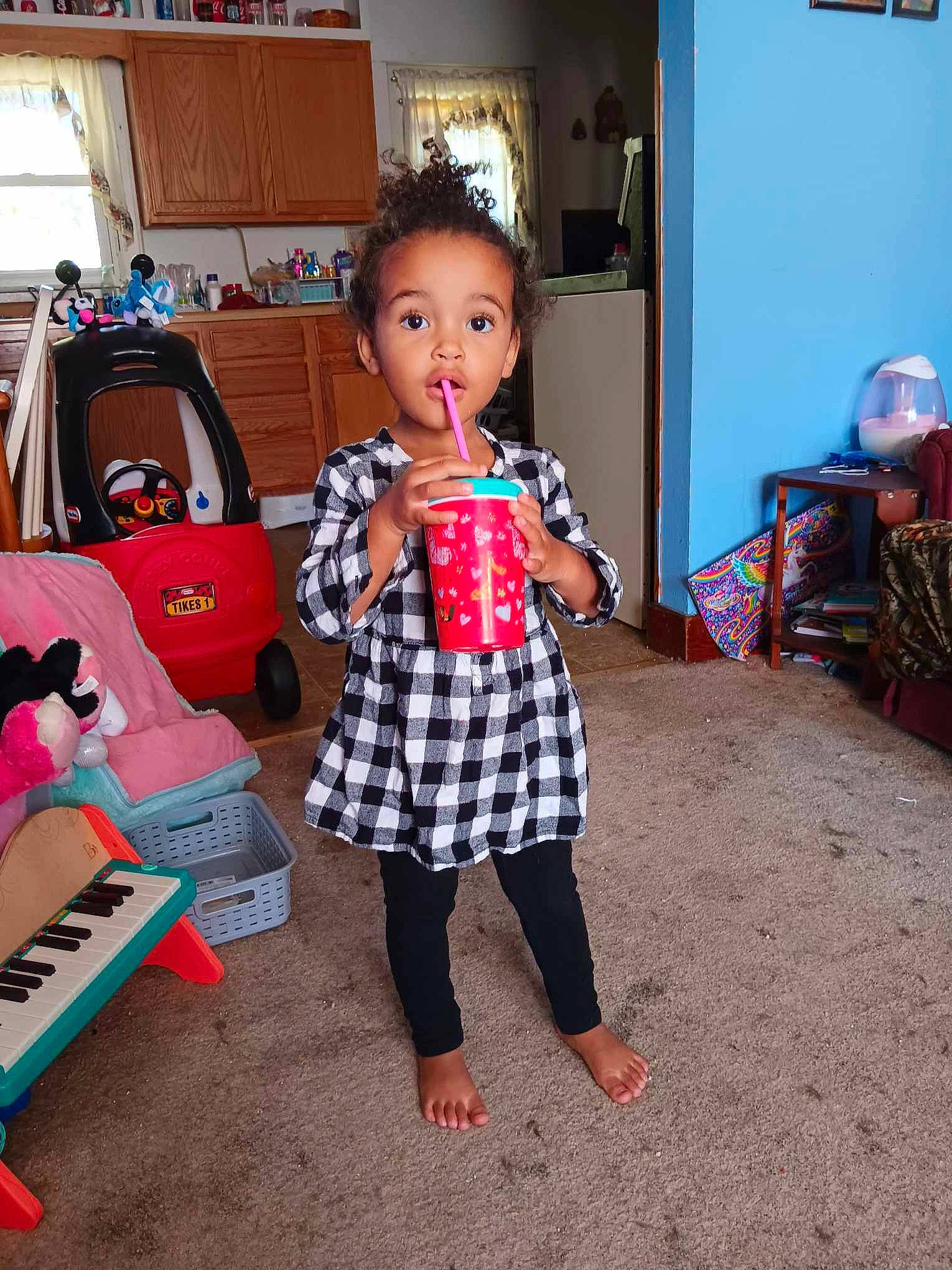 Skylar joined the competition — help win amazing prizes! chair, child, event, flooring, formal_wear, fun, happy, holiday, leisure, musical_instrument, pattern, person, plaid, play, room, sitting, surprise, tartan, toddler, toy