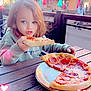 child, pizza, pepperoni, food, outdoor, table, plate, umbrella, person, casual_clothing, daylight, smiling, hair, seat, restaurant, wooden_table, happy, cute, heart_shape, light_effect