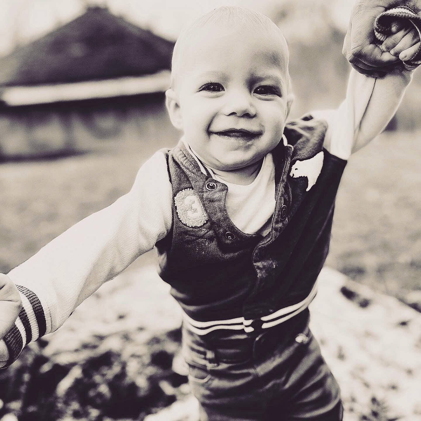 Mason is registered to the contest to win money with this photo: baby, baby_toddler_clothing, black_and_white, child, cool, finger, flash_photography, fun, gesture, grass, happy, iris, joy, monochrome_photography, people_in_nature, person, sleeve, smile, standing, style