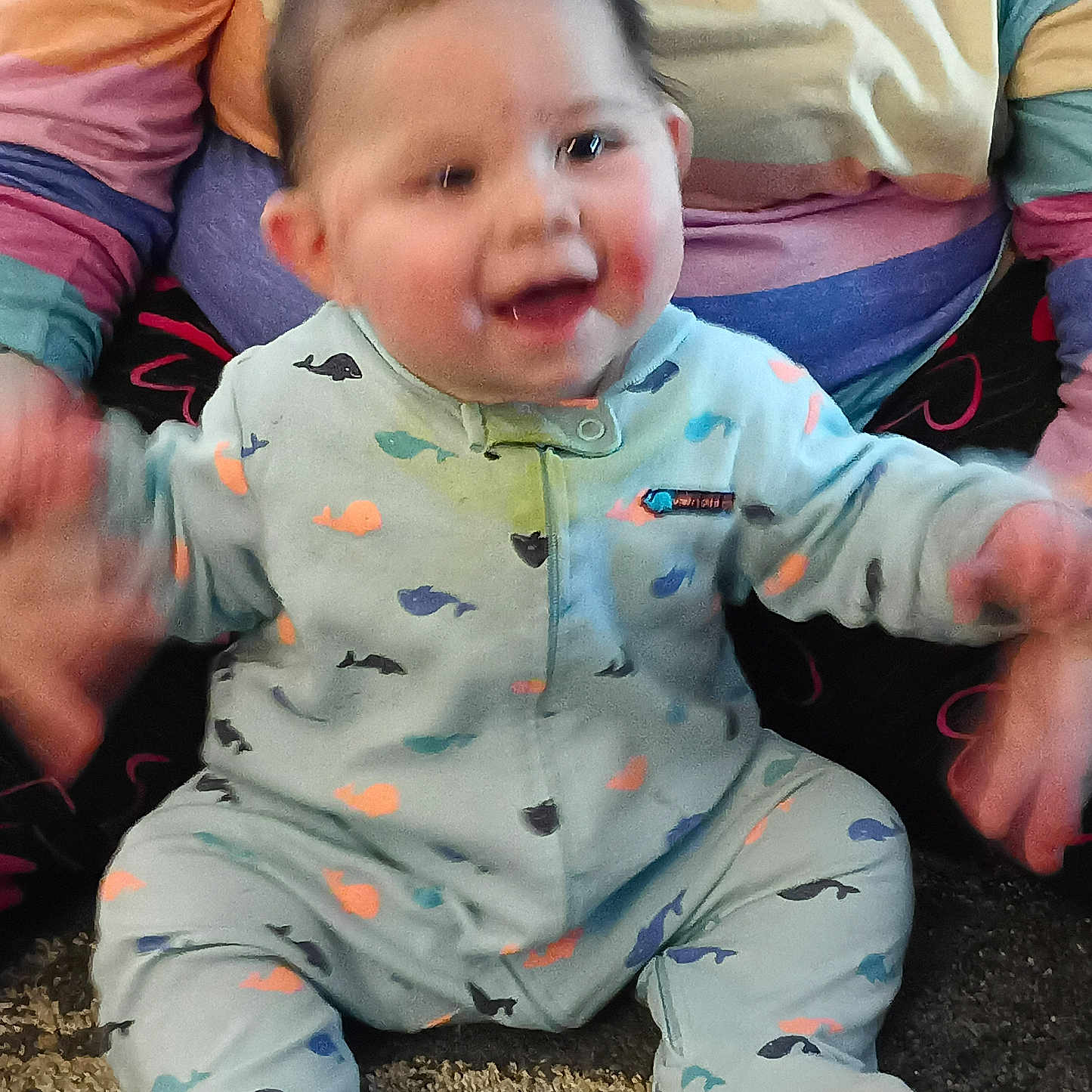 Zander joined the competition — help win amazing prizes! baby, babylaughing, bodypart, clothing, couch, face, finger, hand, happy, head, laughing, mouth, pajamas, pants, person, photography, portrait, sitting, smile, teeth