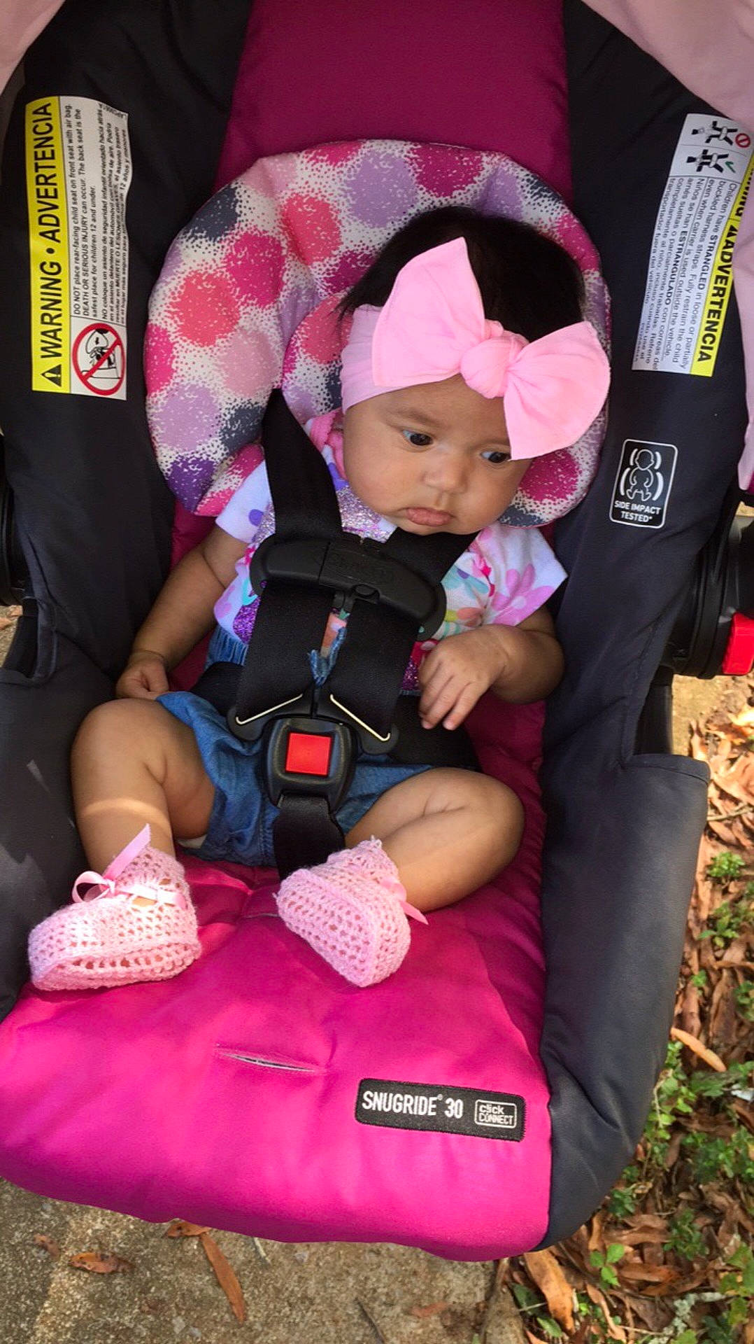 Ellèana is registered to the contest to win money with this photo: baby_carriage, baby_products, car_seat, child, headwear, lap, magenta, person, pink, product, toddler