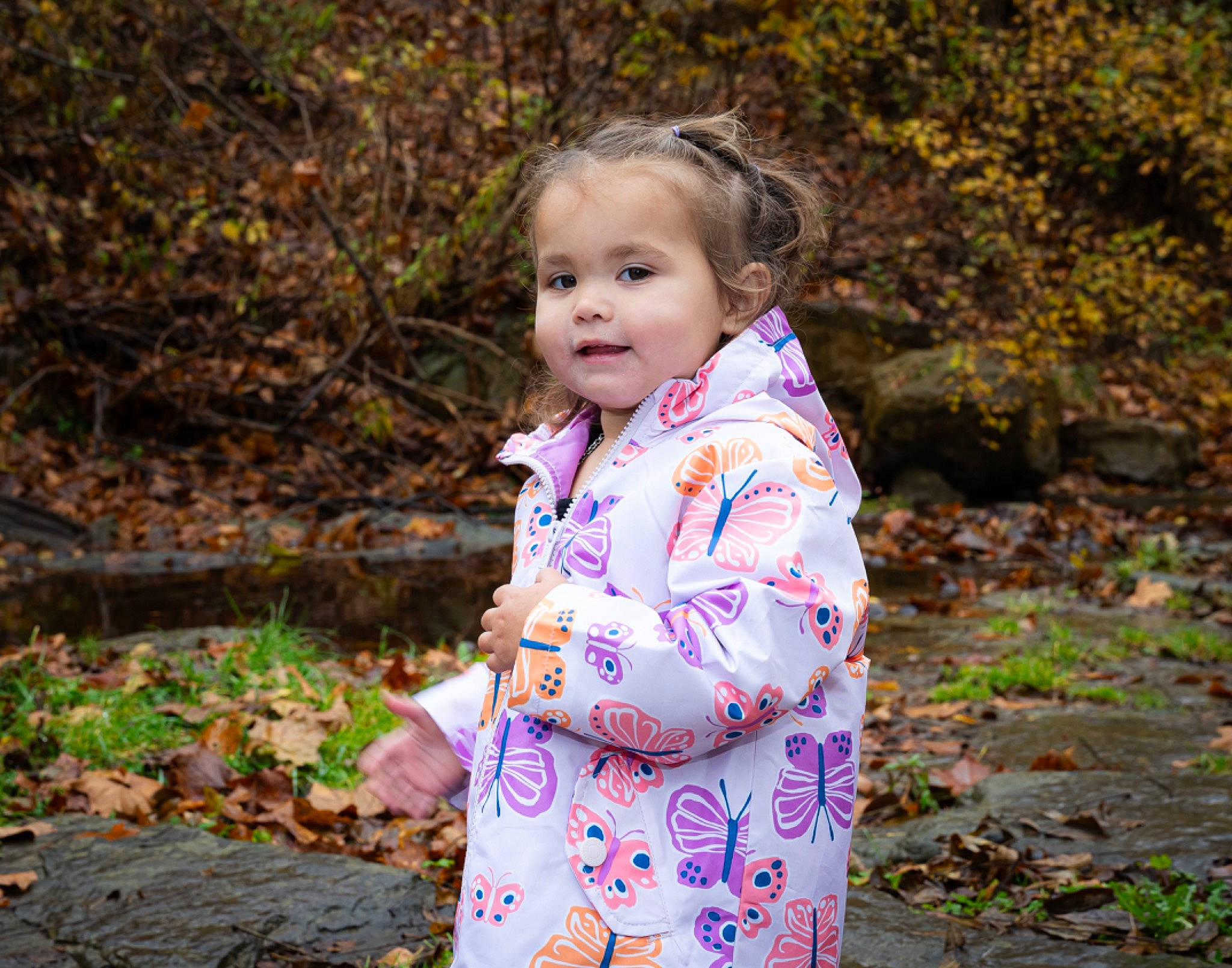Alyvia joined the competition — help win amazing prizes! baby_toddler_clothing, child, forest, fun, grass, happy, leisure, magenta, pattern, people_in_nature, person, plant, sitting, sleeve, smile, soil, spring, toddler, tree, wood