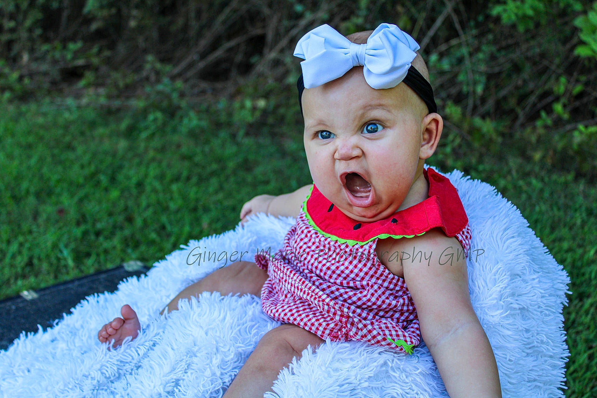 Aryana is registered to the contest to win money with this photo: anger, baby, baby_toddler_clothing, child, dress, face, facial_expression, fun, grass, green, hair_accessory, head, headwear, people, person, photograph, pink, product, purple, skin