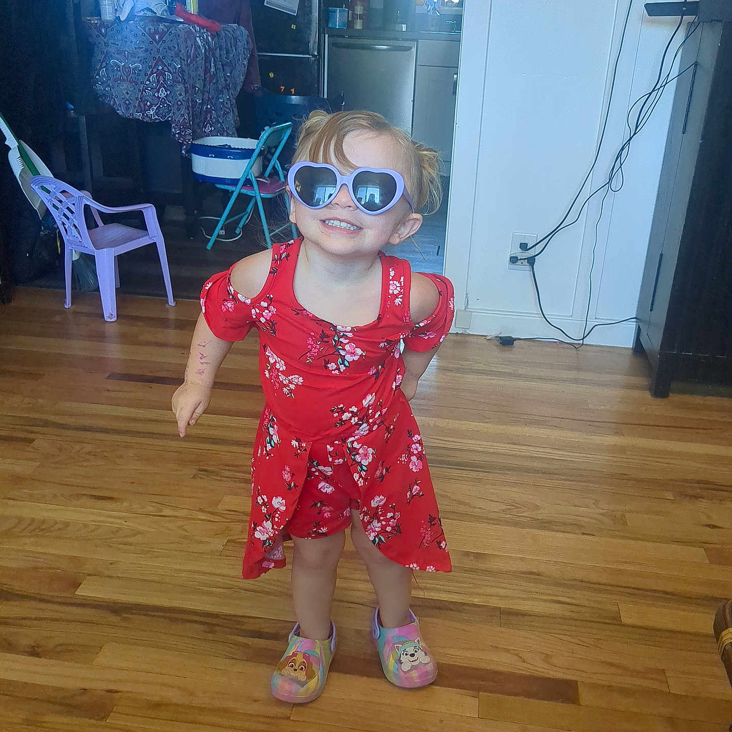 Zamyah is registered to the contest to win money with this photo: accessories, baby, chair, clothing, dress, footwear, formalwear, furniture, glasses, goggles, hardwood, indoors, interiordesign, person, plywood, sandal, shoe, shorts, sunglasses, wood