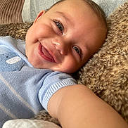 Roman joined the competition — help win amazing prizes! baby, blue_clothing, child, close_up, comfort, cushion, cute, eyelashes, face, furry_blanket, happy, indoors, infant, knitwear, portrait, relaxation, selfie, skin, smiling, soft_texture