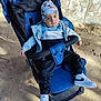 boy, cap, child, clothing, coat, face, footwear, furniture, hat, head, jacket, jeans, male, pants, person, photography, portrait, shoe, sneaker, stroller