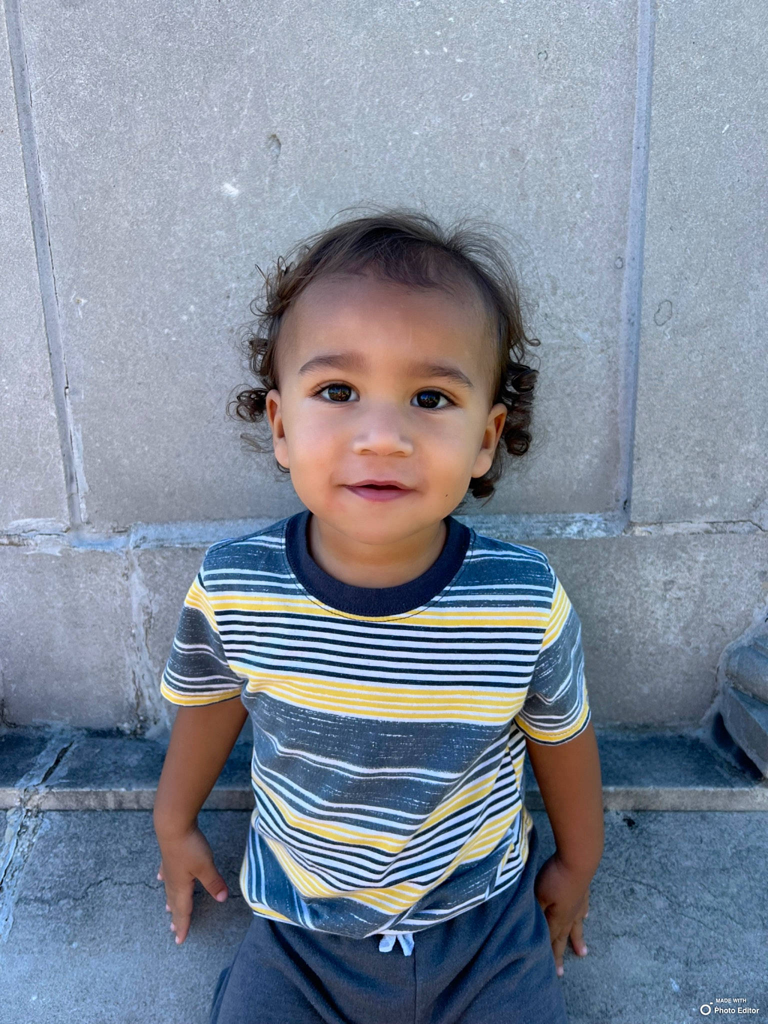 Traycen is registered to the contest to win money with this photo: baby_toddler_clothing, child, chin, concrete, electric_blue, face, flash_photography, fun, happy, joy, pattern, person, photograph, sitting, skin, sleeve, smile, t_shirt, toddler, vacation