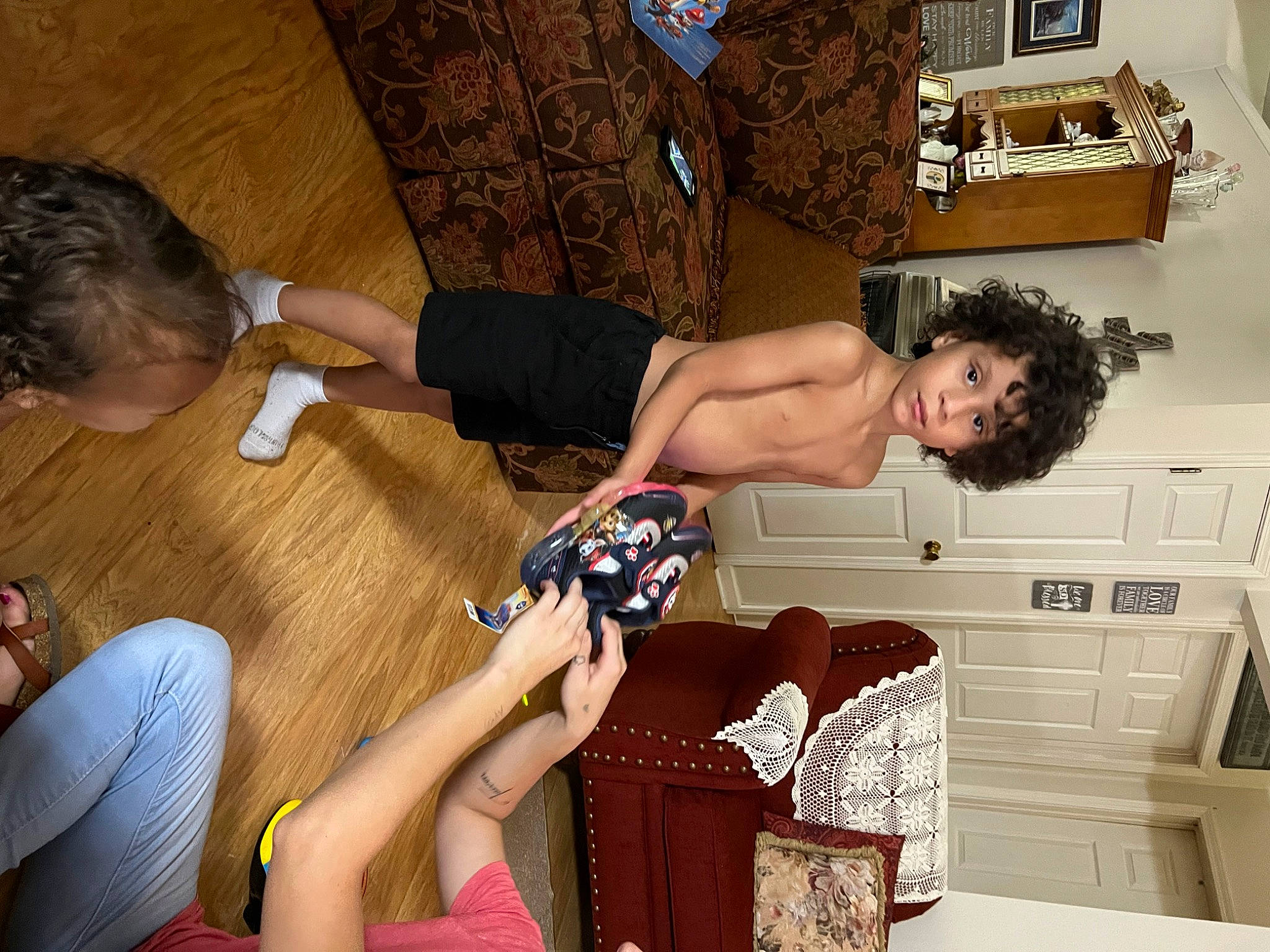 Taivon joined the competition — help win amazing prizes! arm, cabinetry, child, comfort, elbow, flooring, fun, hardwood, human_leg, joint, knee, lap, leisure, nail, person, room, sitting, thigh, trunk, wood