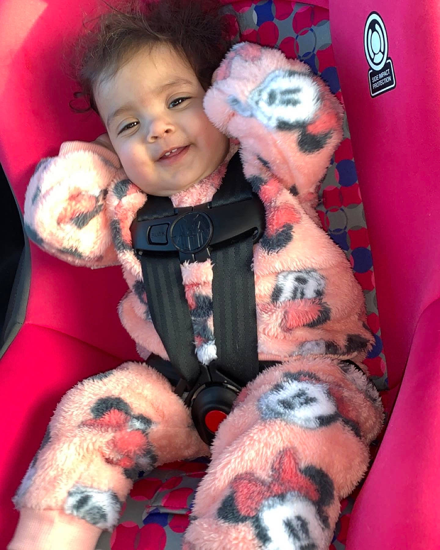 Honesty is registered to the contest to win money with this photo: baby, baby_toddler_clothing, comfort, eye, finger, happy, head, human_body, lap, leg, nail, organ, person, pink, red, skin, smile, stuffed_toy, textile, thigh