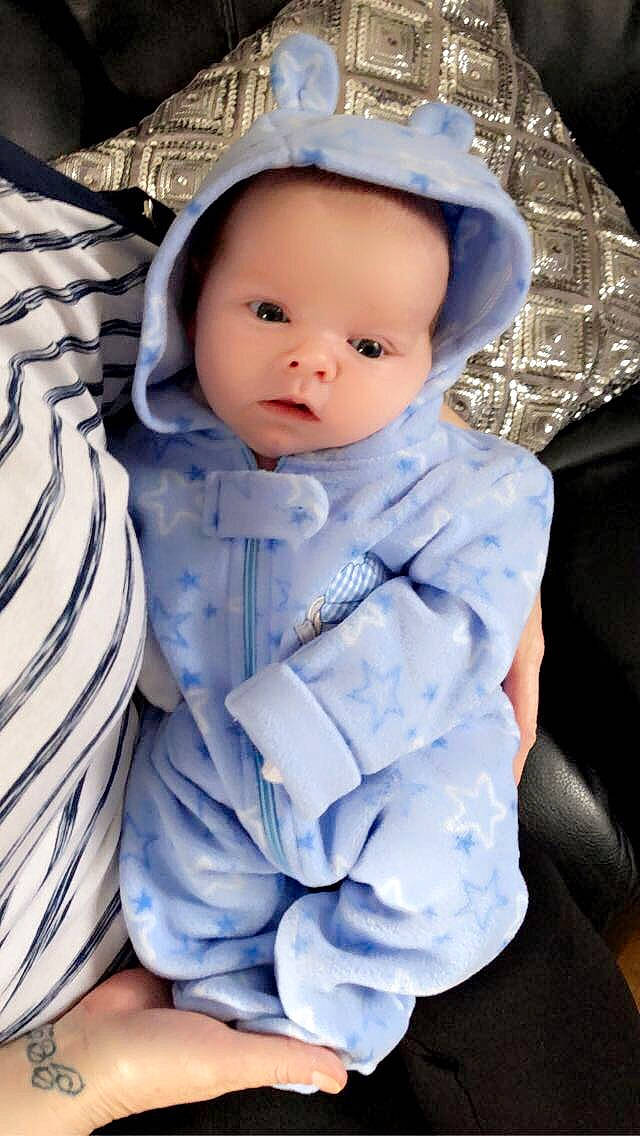 Colton joined the competition — help win amazing prizes! baby, baby_products, baby_toddler_clothing, cap, cheek, child, comfort, doll, electric_blue, eye, eyelash, fur, head, iris, lip, person, sitting, skin, sleeve, toddler