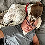 Sally participe au concours pour gagner de l'argent avec cette photo : casual, comfort, couch, cozy, dog, friendship, glasses, gray_shirt, human, indoor, laying_down, man, nap, pet, pillow, red_collar, relaxing, resting, sleeping_dog, spotted_dog
