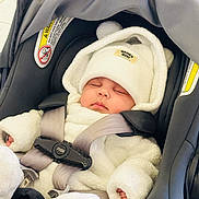 Yazan joined the competition — help win amazing prizes! baby, sleeping, car_seat, white_clothing, hat, infant, child, straps, cozy, cute, peaceful, soft_texture, bundle, newborn, seatbelt, indoor, closeup, adorable, warm, portrait