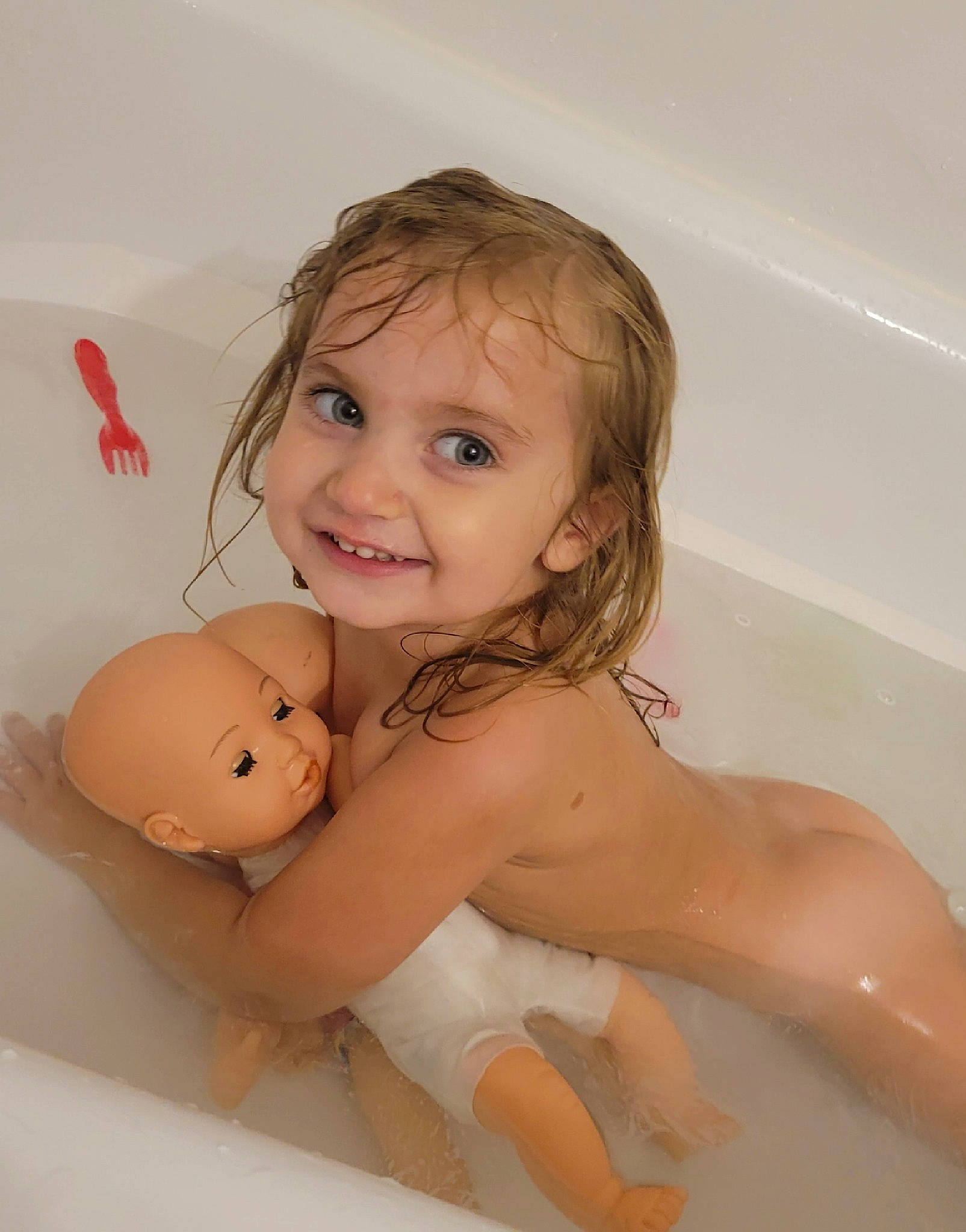 Nova is registered to the contest to win money with this photo: abdomen, bathing, bathroom, bathtub, cheek, chest, child, eye, face, fawn, fluid, happy, head, joy, person, skin, smile, stomach, toddler, toy