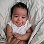 Azriella joined the competition — help win amazing prizes! baby, smiling, blanket, hand, infant, cute, person, child, cozy, happy, sleepwear, skin, face, holding, bed, comfort, toddler, family, love, expression