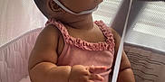 Merxin joined the competition — help win amazing prizes! baby, child, party_hat, pink_clothing, plush_toy, playpen, curious, indoor, soft_light, window_blinds, chubby_cheeks, sitting, infant, cute, celebration, pom_pom, looking_up, soft_texture, adorable, young_child