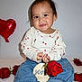 baby, child, rose, red_rose, heart_balloon, balloon, jeans, white_background, barefoot, smiling, portrait, milestone, seven_months, long_sleeve_shirt, heart_pattern, cute, sitting, person, indoor, celebration