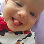 baby, close_up, smiling, tongue_out, child, cow_print, cookie_pattern, clothing, face, cheerful, outdoor, person, cute, infant, happy, head, skin, tongue, purple_background, nature