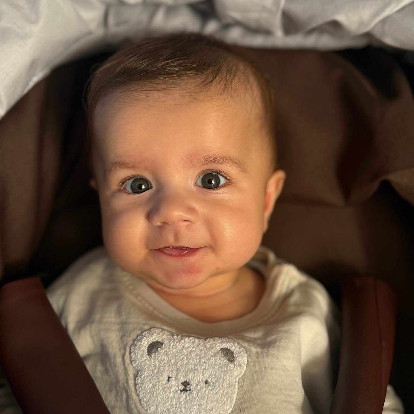 Aris is registered to the contest to win money with this photo: baby, bed, bodypart, car, clothing, couch, cushion, face, finger, furniture, hand, happy, head, homedecor, newborn, person, photography, portrait, smile, t_shirt