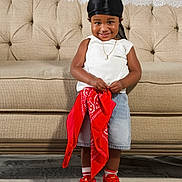 Jaicere joined the competition — help win amazing prizes! toddler, child, smiling, standing, red_sneakers, black_durag, white_top, denim_skirt, red_bandana, beige_couch, indoor, portrait, happy, cute, person, floor_covering, jewelry, necklace, fashion, casual