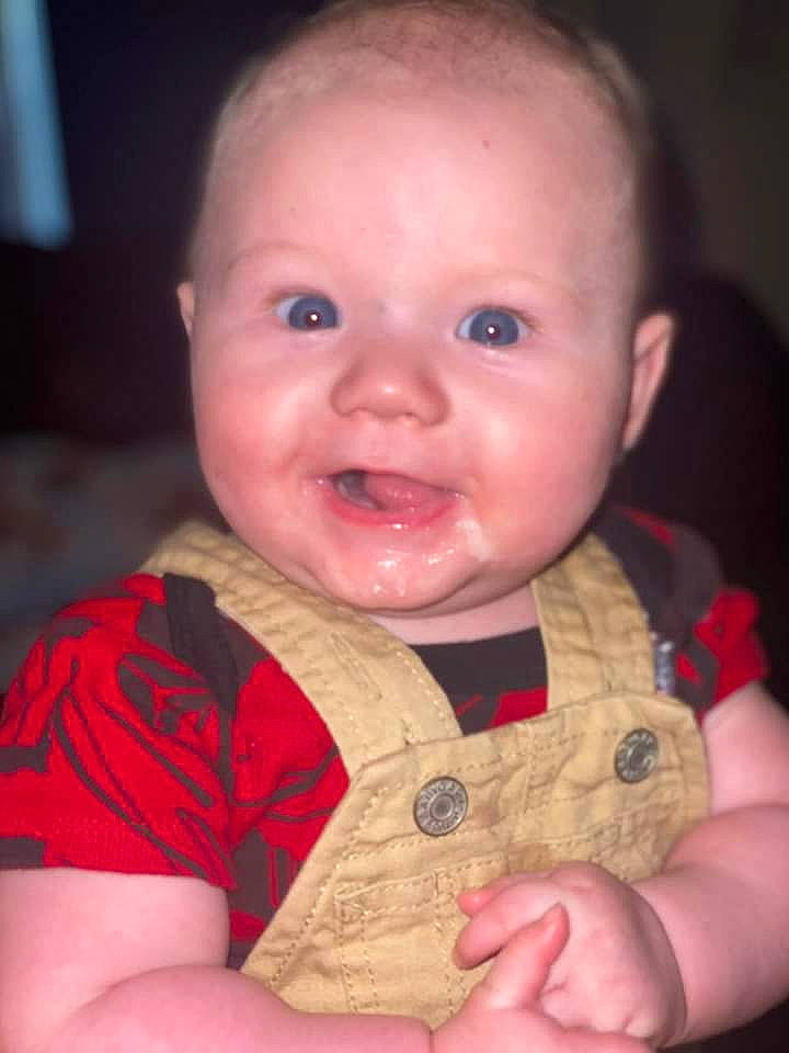 Leland is registered to the contest to win money with this photo: baby, baby_toddler_clothing, cheek, chin, eyebrow, finger, fun, happy, human_body, iris, lip, mouth, nose, organ, person, pink, skin, sleeve, smile, thumb
