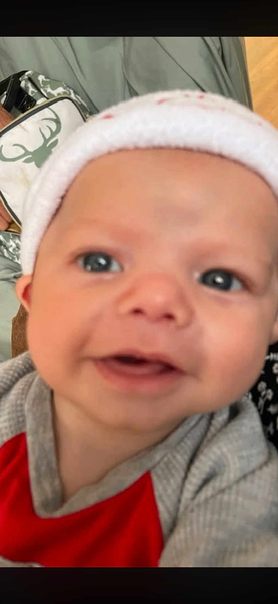 Elijah Davis joined the competition — help win amazing prizes! baby, child, face, smile, hat, clothing, closeup, indoor, person, infant, cute, portrait, red, grey, headwear, apparel, babywear, young, happy, babyface