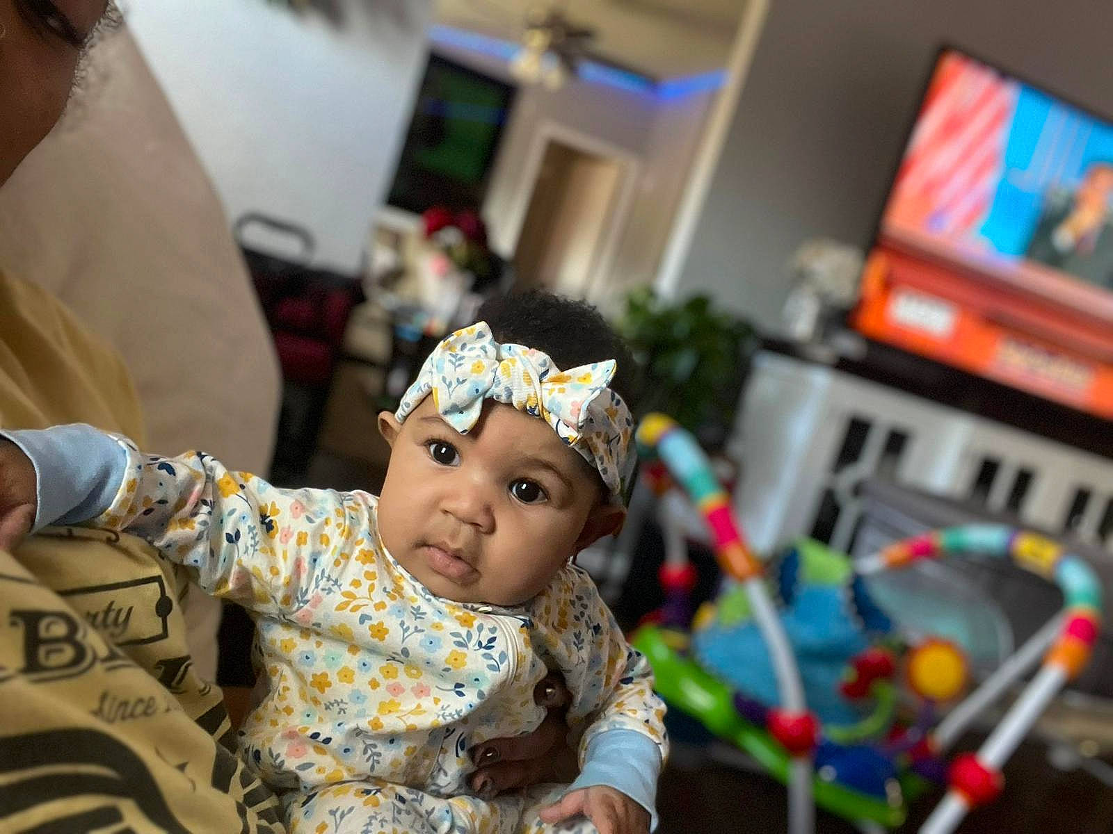 Eliana joined the competition — help win amazing prizes! baby, baby_toddler_clothing, child, couch, display_device, event, fun, happy, headwear, leisure, machine, person, room, sitting, television, toddler, tradition