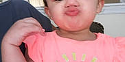 Pheonix joined the competition — help win amazing prizes! toddler, child, pink_shirt, sun_graphic, heart_shaped_glasses, indoor, pouty_face, cute, person, young_child, short_hair, smiling_sun, casual_clothing, funny_expression, hand_near_face, bright_colors, home_interior, portrait, baby, infant