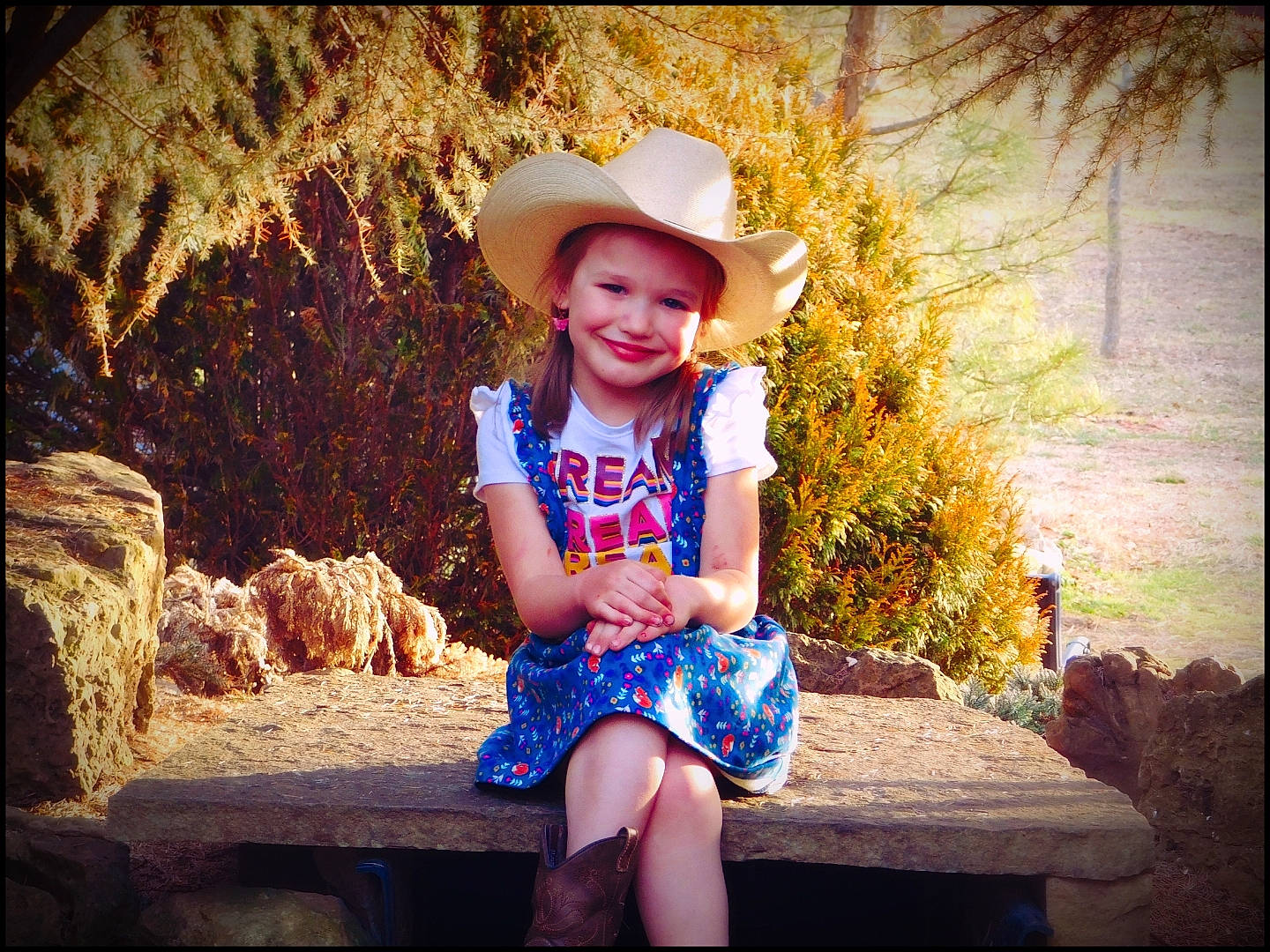Piper is registered to the contest to win money with this photo: clothing, face, flash_photography, fun, grass, happy, hat, headwear, joy, leaf, lighting, morning, nature, people_in_nature, person, plant, smile, summer, sun_hat, sunlight