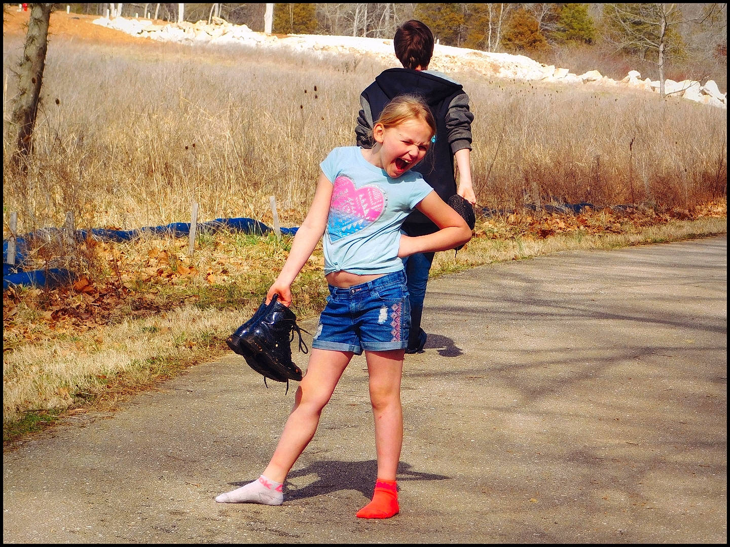 Harlee joined the competition — help win amazing prizes! barefoot, child, denim, electric_blue, fun, gesture, grass, happy, landscape, leg, leisure, people_in_nature, person, plant, recreation, shorts, t_shirt, toddler, travel, tree