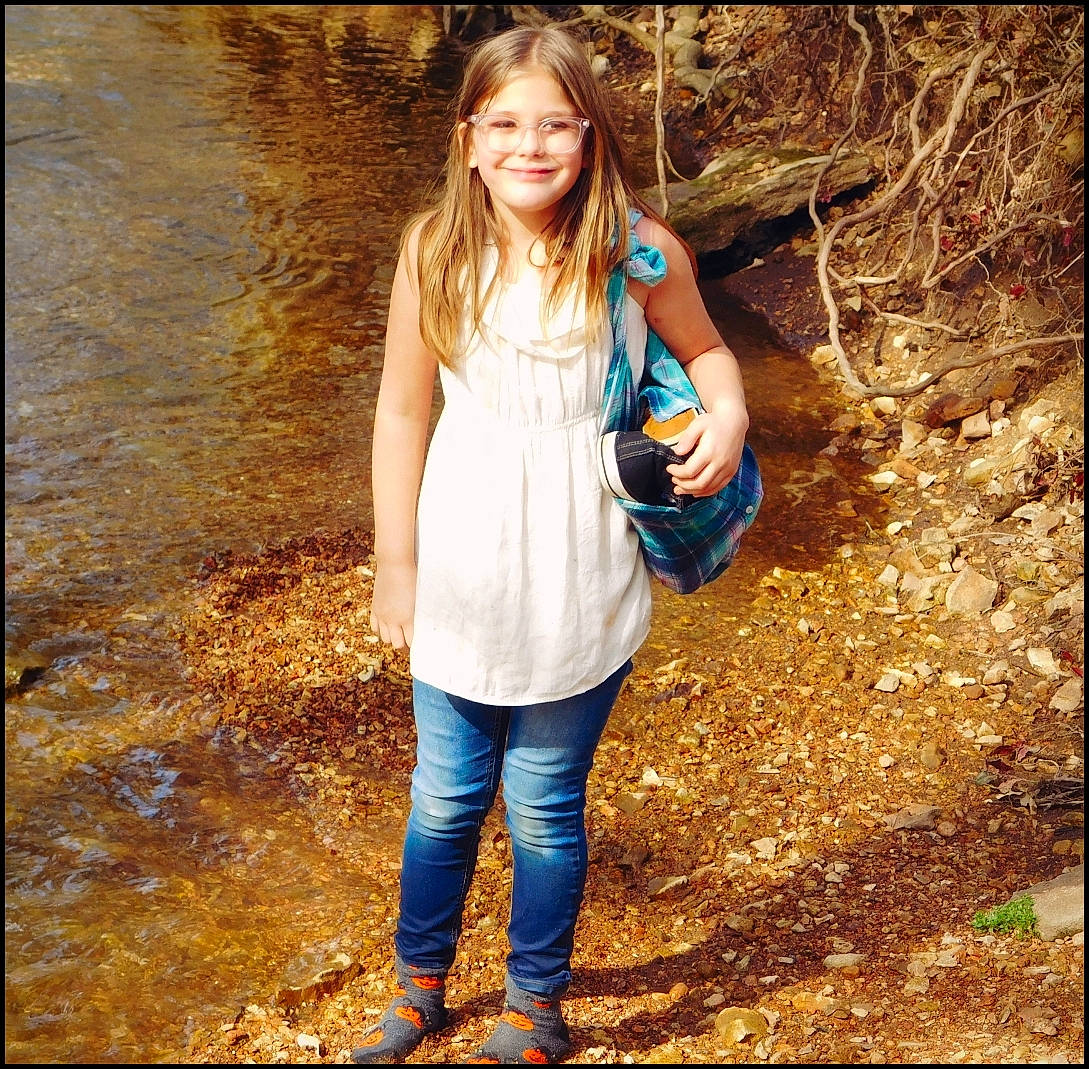 Lynnzie is registered to the contest to win money with this photo: blond, boot, brown_hair, child, clothing, denim, electric_blue, flash_photography, forest, fun, grass, happy, jeans, joy, leisure, long_hair, people_in_nature, person, sunlight, t_shirt