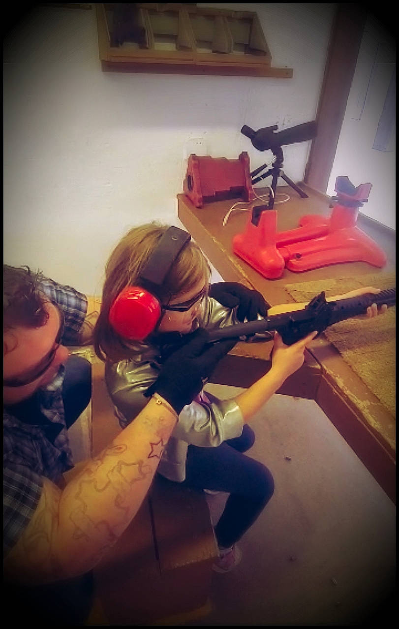 Lynnzie joined the competition — help win amazing prizes! air_gun, art, carmine, eyewear, flooring, fun, metal, music_venue, person, personal_protective_equipment, picture_frame, recreation, room, shooting, shotgun, square, tattoo, tints_and_shades, trigger, visual_arts