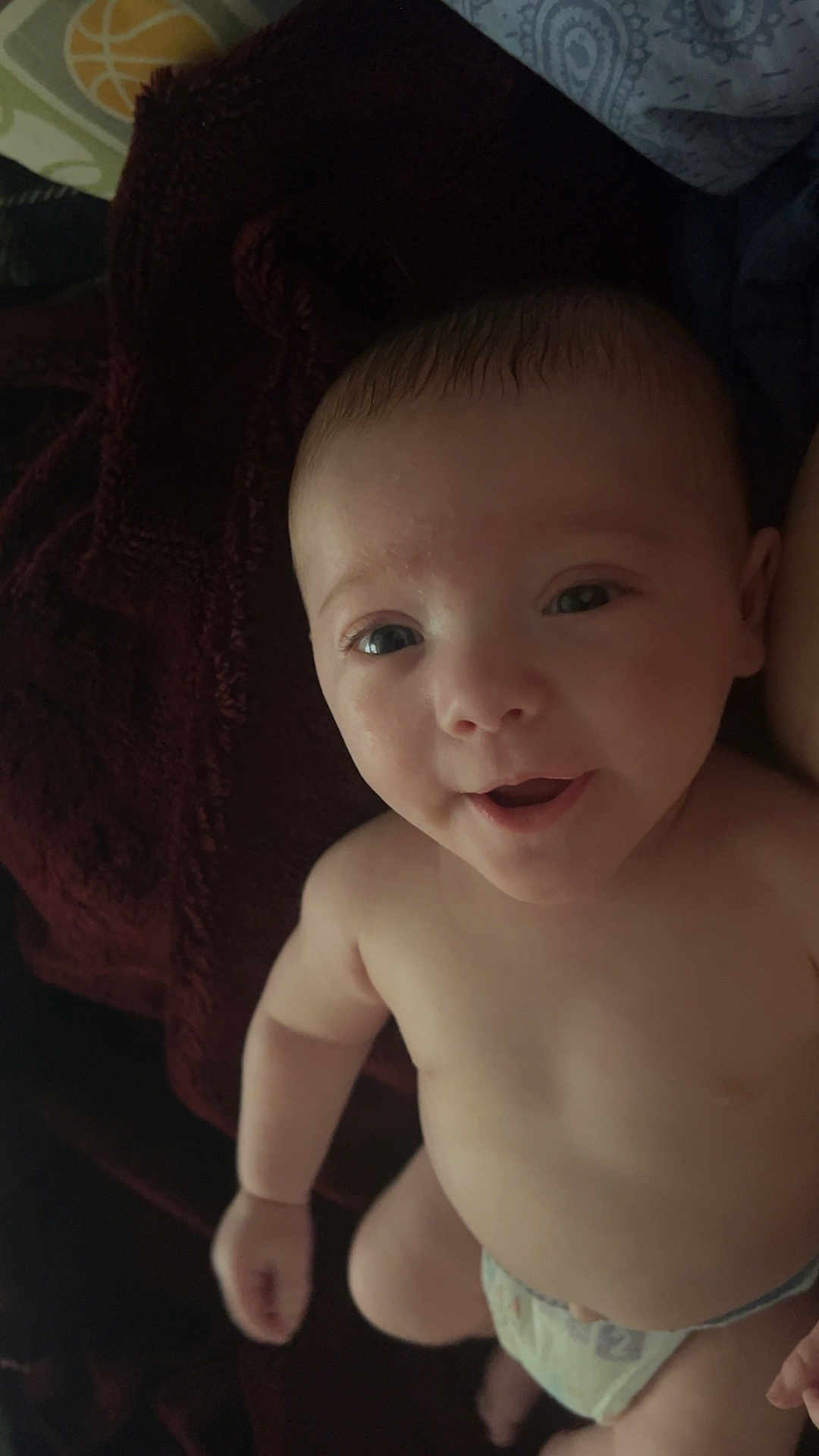 Cassiel is registered to the contest to win money with this photo: baby, infant, diaper, smile, face, skin, arm, hand, lying_down, blanket, fabric, comfort, cute, child, young, human, portrait, indoors, expression, happy