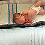 newborn, baby, diaper, sleeping, blanket, playpen, infant, skin, peaceful, resting, child, cute, young, lying_down, indoors, soft, striped, bed, comfort, toddler