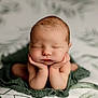 Dawson is registered to the contest to win money with this photo: newborn, baby, infant, sleeping, hands, face, soft, blanket, green, wrapped, cute, peaceful, portrait, closeup, skin, young, resting, child, background, indoors