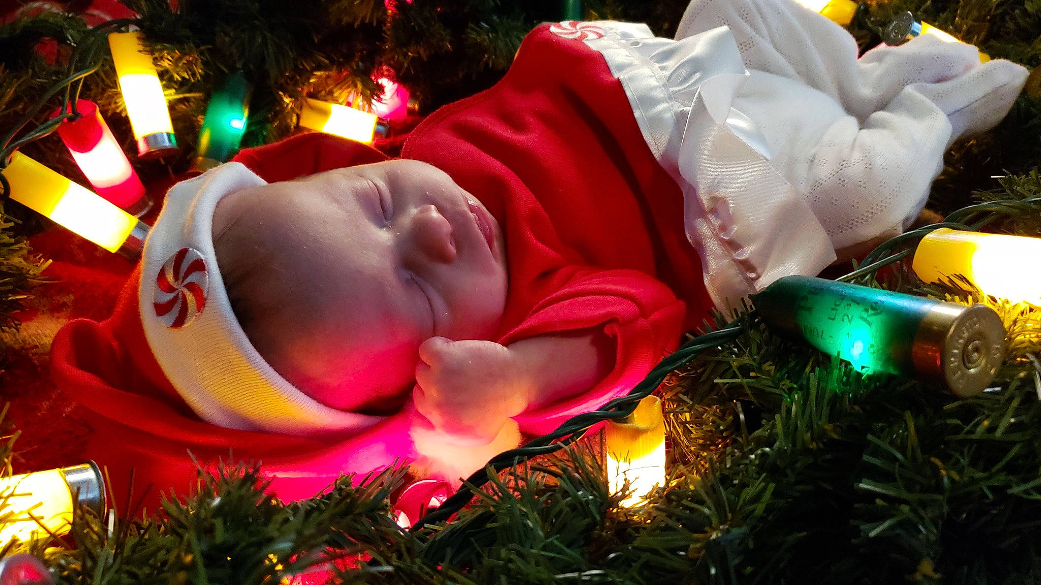 Tatum is registered to the contest to win money with this photo: christmas, christmas_decoration, christmas_eve, christmas_lights, christmas_ornament, christmas_tree, event, fictional_character, fir, fun, holiday, interior_design, person, plant, tree