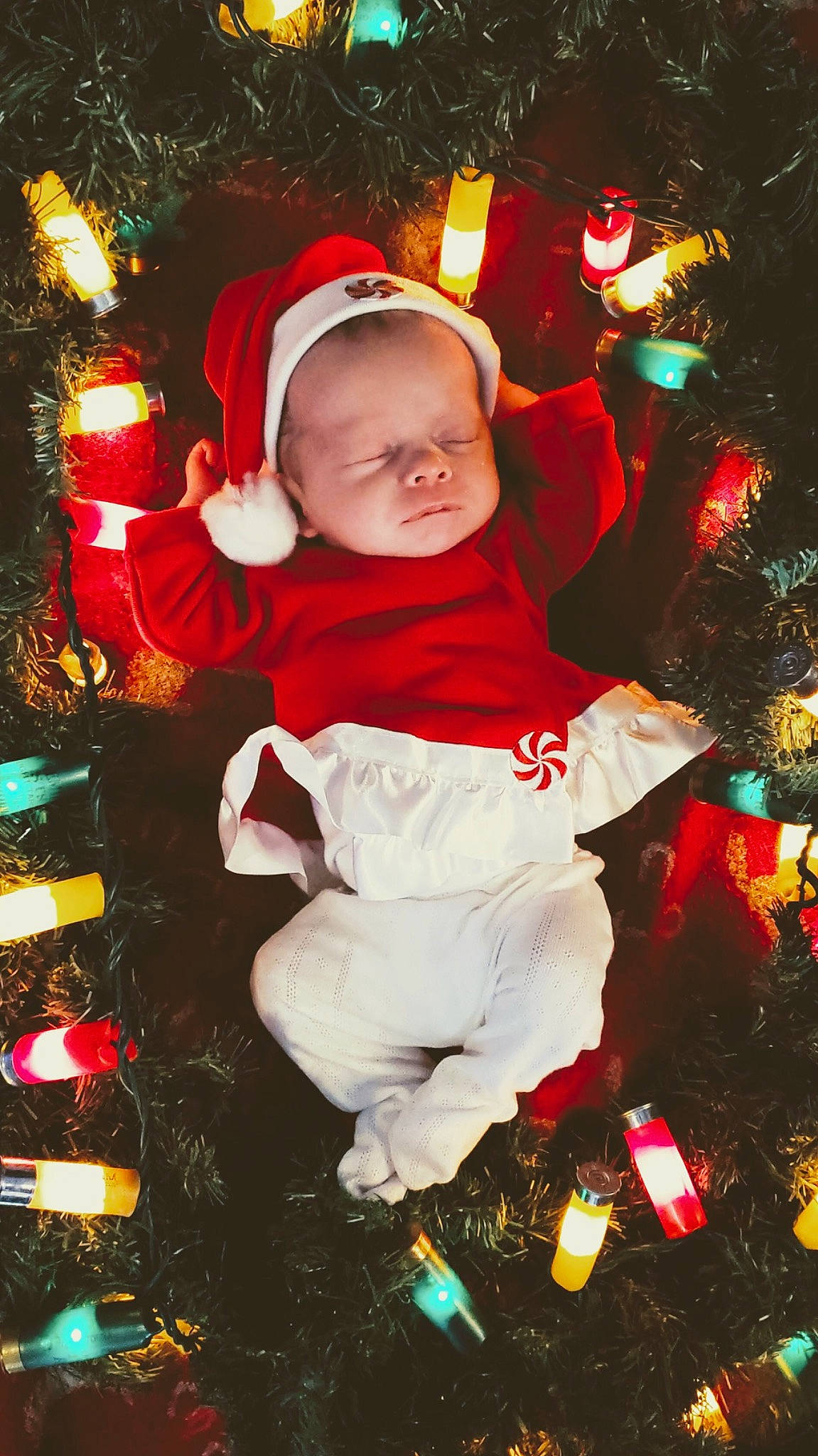 Tatum is registered to the contest to win money with this photo: child, christmas, christmas_decoration, christmas_eve, christmas_lights, christmas_ornament, christmas_tree, event, fictional_character, fir, fun, happy, holiday, interior_design, person, photography, plant, santa_claus, toddler, tree