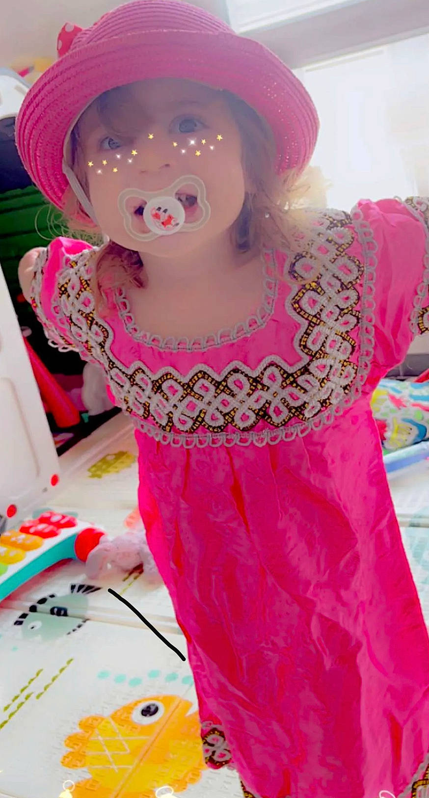 Iris participe au concours pour gagner de l'argent avec cette photo : barbie, cap, child, day_dress, doll, dress, event, fashion_accessory, fashion_design, formal_wear, hat, magenta, one_piece_garment, pattern, person, pink, red, sleeve, textile, toy