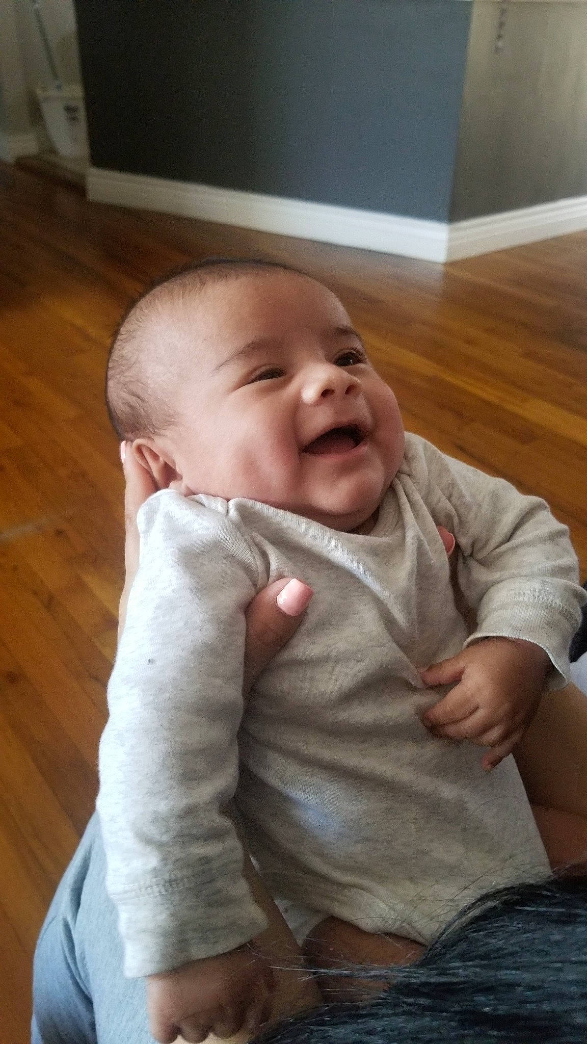 Ezequiel is registered to the contest to win money with this photo: baby, cheek, child, chin, ear, face, facial_expression, head, laugh, mouth, nose, person, sitting, skin, smile, toddler