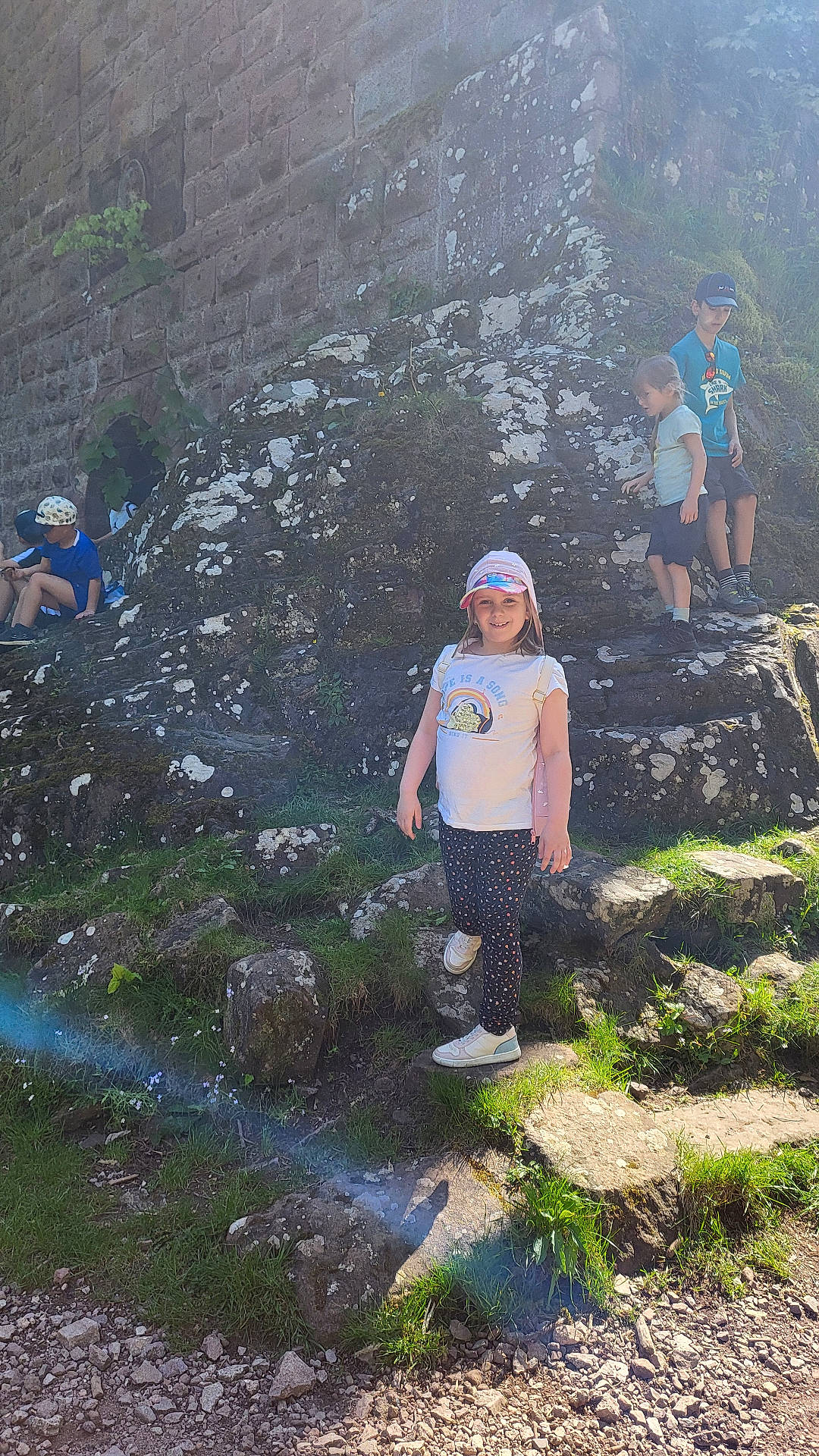 Héléna participe au concours pour gagner de l'argent avec cette photo : adventure, boy, child, clothing, female, footwear, girl, helmet, hiking, leisureactivities, male, nature, outdoors, path, person, rock, shorts, slate, t_shirt, teen