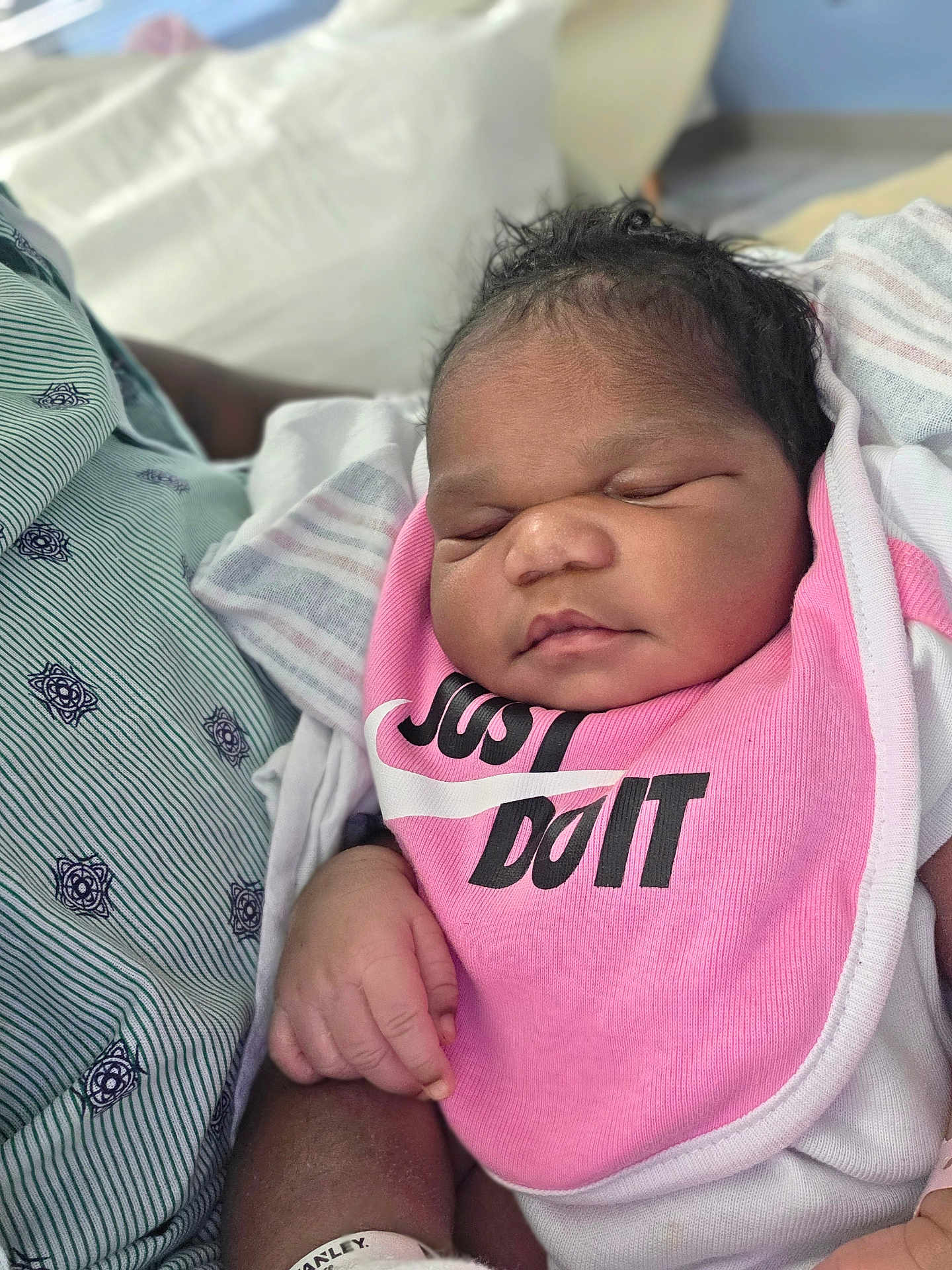 Lyriq joined the competition — help win amazing prizes! newborn, baby, infant, sleeping, bib, pink, clothing, hand, person, closeup, portrait, skin, face, cute, peaceful, resting, indoor, fabric, holding, soft