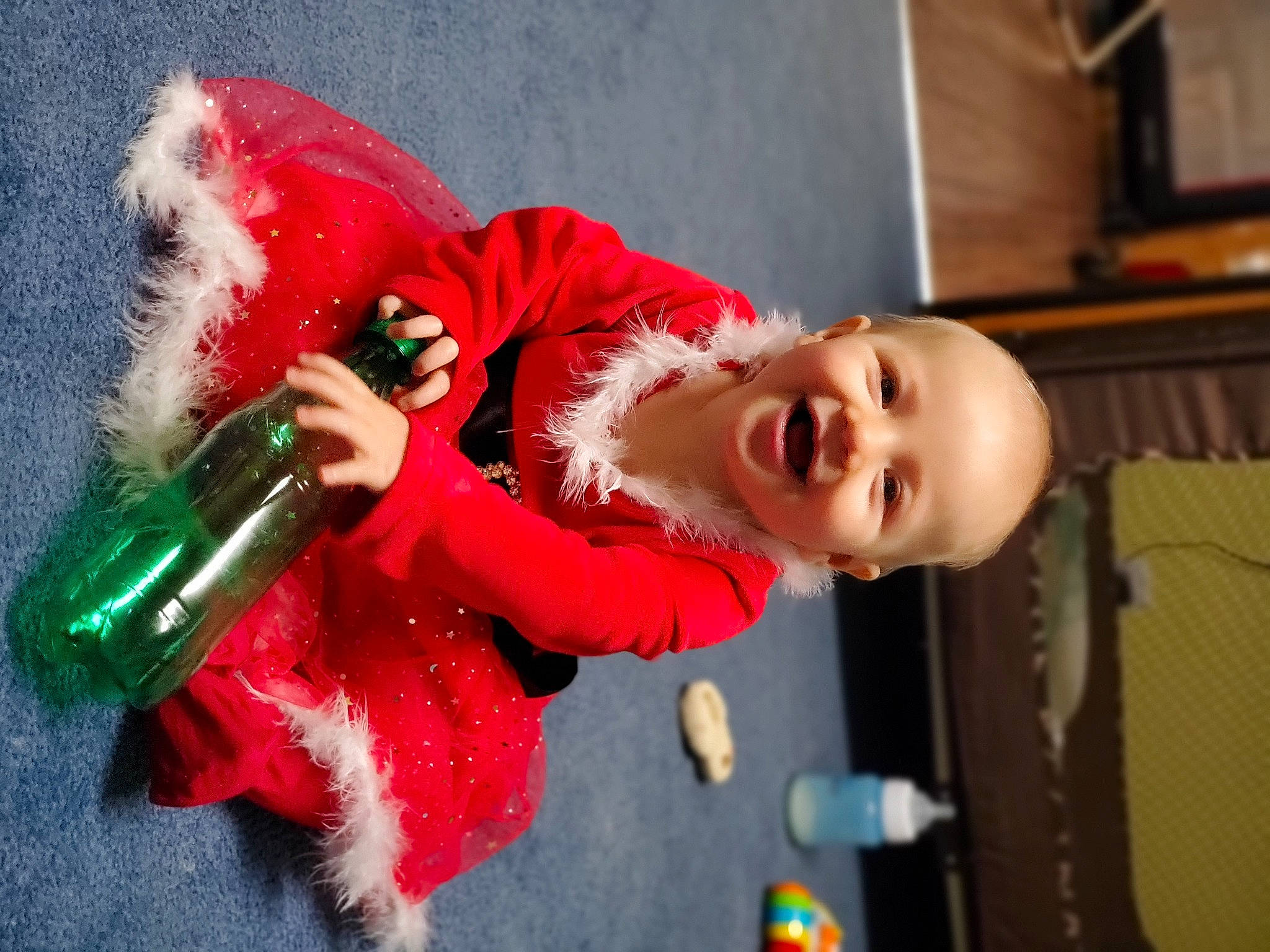 Paisli joined the competition — help win amazing prizes! baby, carmine, child, christmas, costume, event, fictional_character, fun, fur, glove, happy, holiday, joy, magenta, pattern, person, santa_claus, smile, toddler, wig