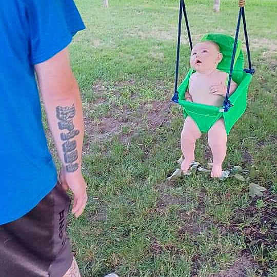 Veda joined the competition — help win amazing prizes! baby, blue, city, fun, grass, grassland, green, happy, human_leg, leg, leisure, outdoor_play_equipment, plant, playground, recreation, shorts, swing, t_shirt, toddler, tree