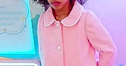 Marni joined the competition — help win amazing prizes! arcade_kiosk, buttons, casual_coat, child, curly_hair, eyes, face, fashion, glowing_light, indoor, mouth, pastel_background, photo_booth, pink_coat, portrait, retail_kiosk, standing, surprised_expression, toy_machine, young_girl